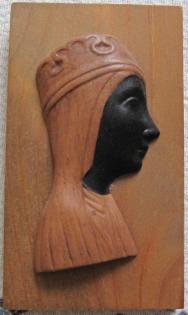 Holzrelief schwarze Frau 