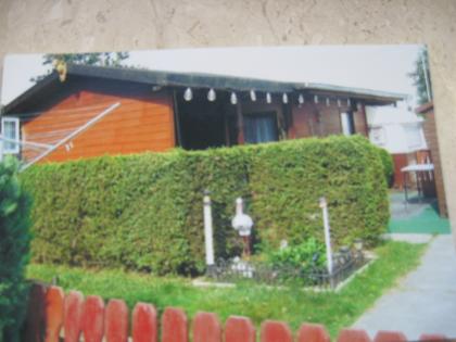Grosser wohnwagen mit 5 schlafplätzen eingebaut in einem sehr schönen holzhaus a